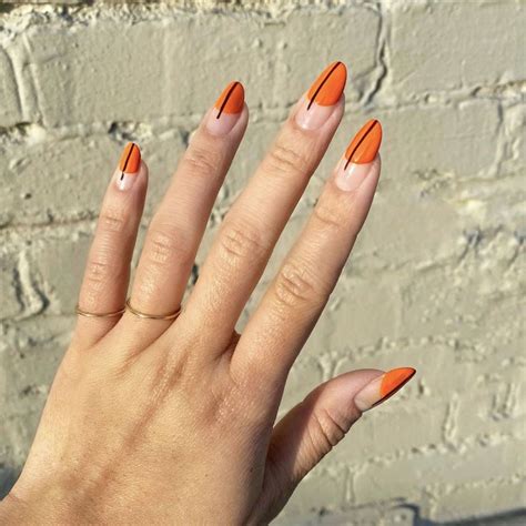 black nails orange tips